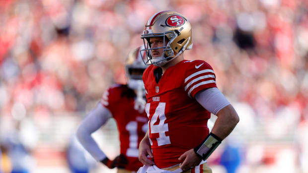 Jan 7, 2024; Santa Clara, California, USA; San Francisco 49ers quarterback Sam Darnold (14) and wide receiver Brandon Aiyuk (11) look on during the second quarter against the Los Angeles Rams at Levi's Stadium. Mandatory Credit: Sergio Estrada-USA TODAY Sports